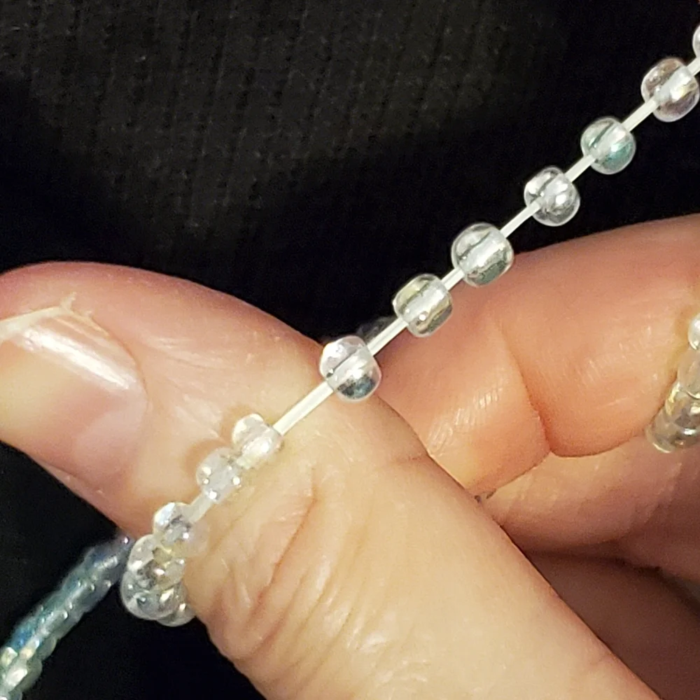 Clear iridescent beaded stretch necklace 14 inches long unstretched